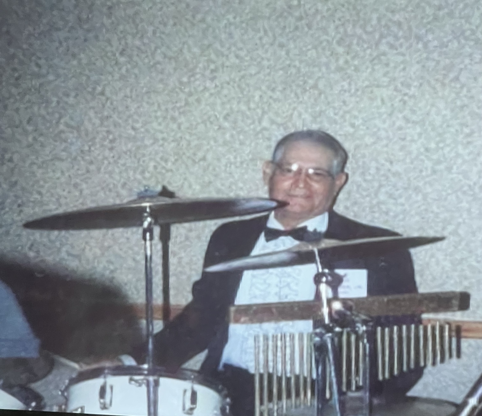 Joe Azcona Jr. seated behind drums and cymbals