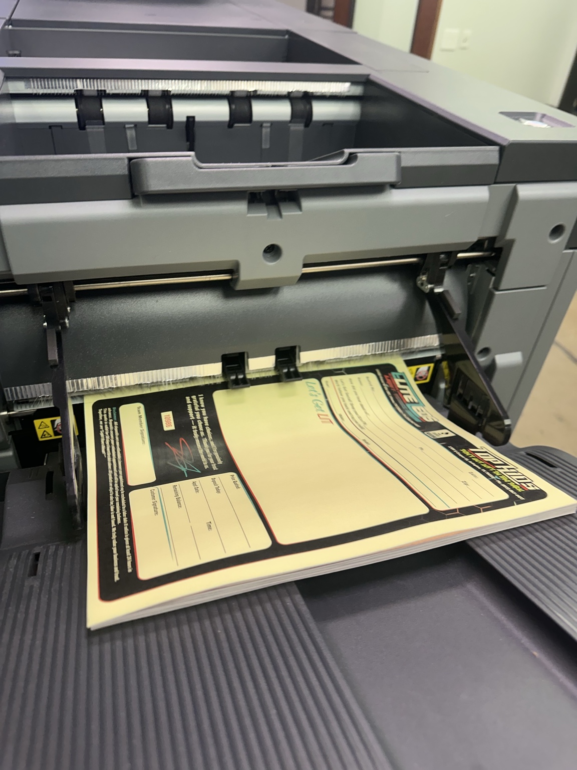 Three color carbon copy sheets in production